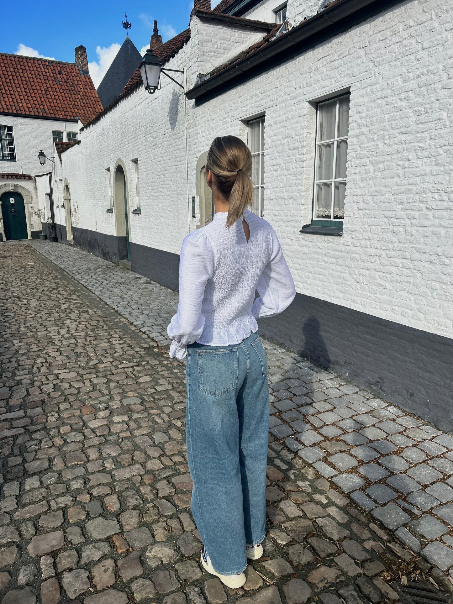 White ruffle blouse