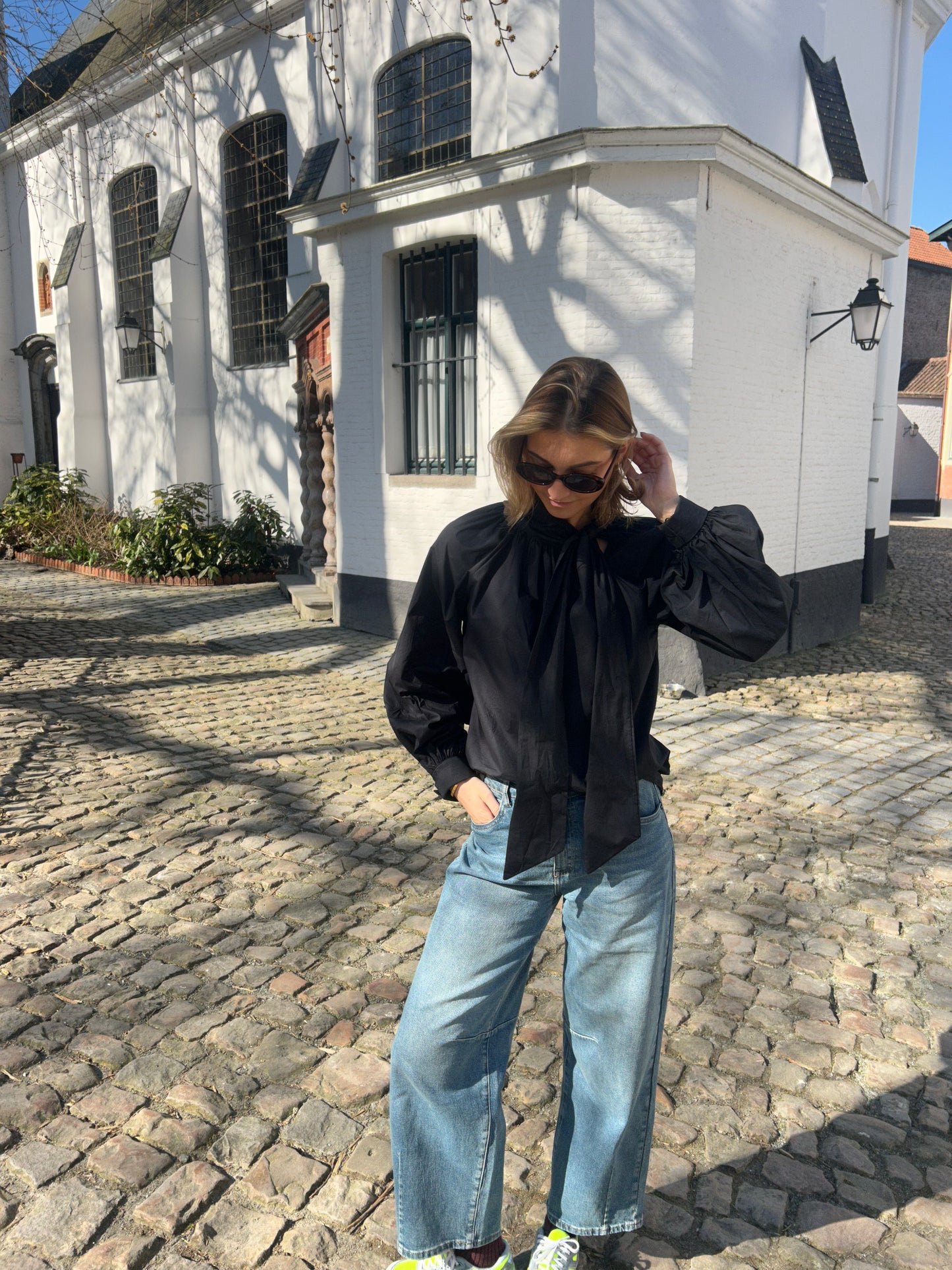 Loose blouse with bow neck